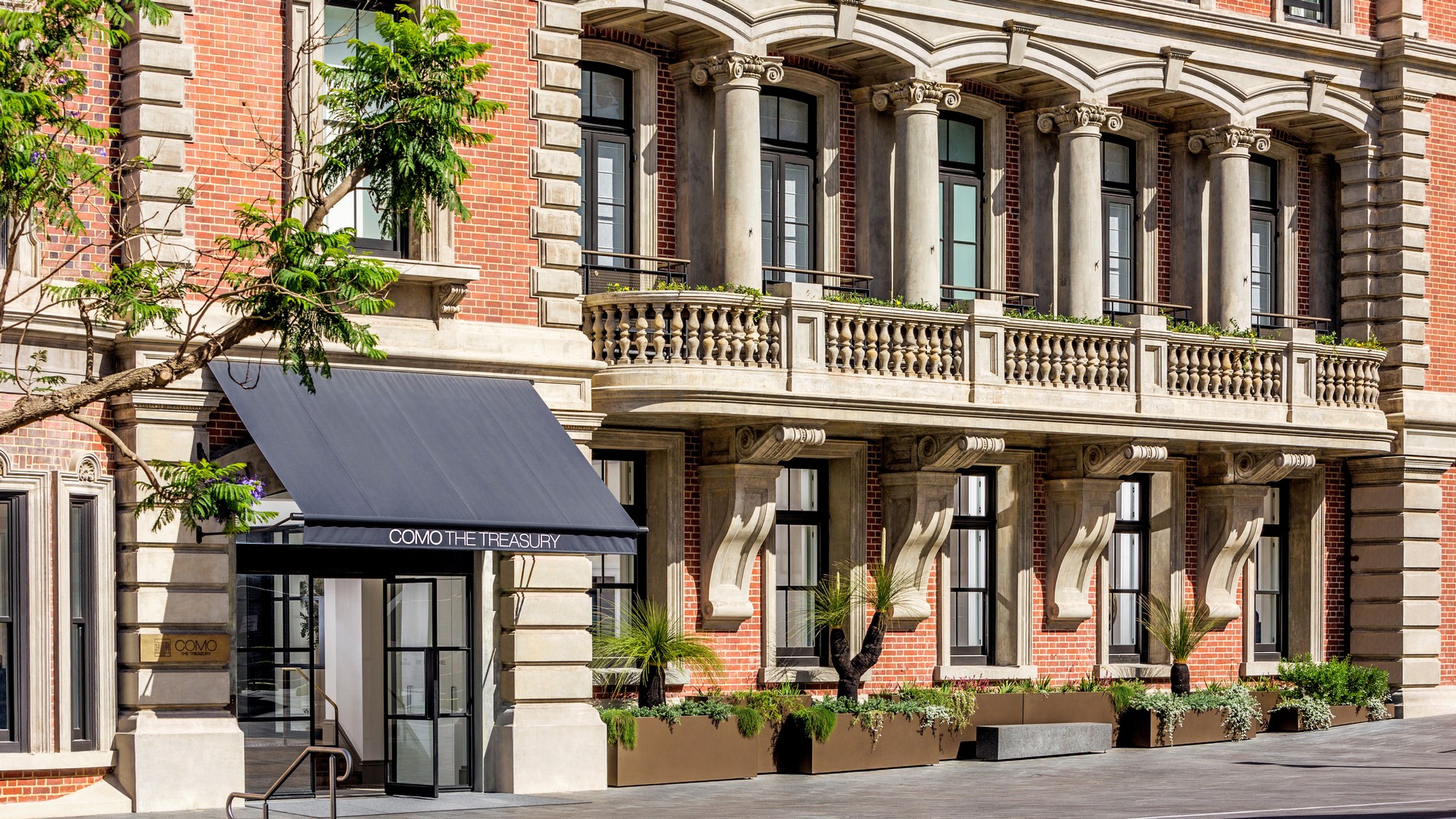 The street view of the elegant COMO The Treasury hotel