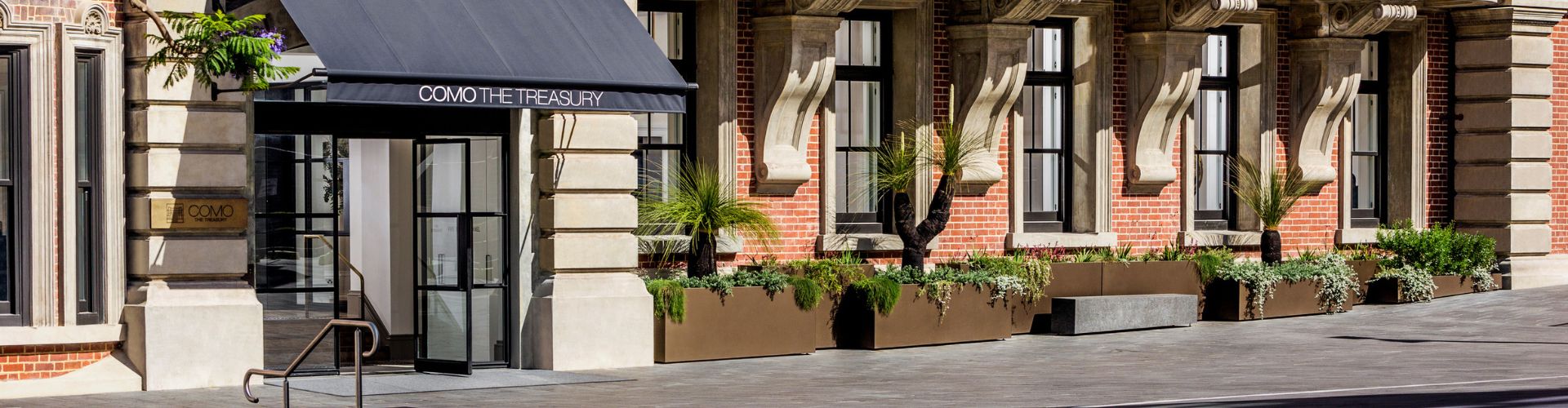 The street view of the elegant COMO The Treasury hotel