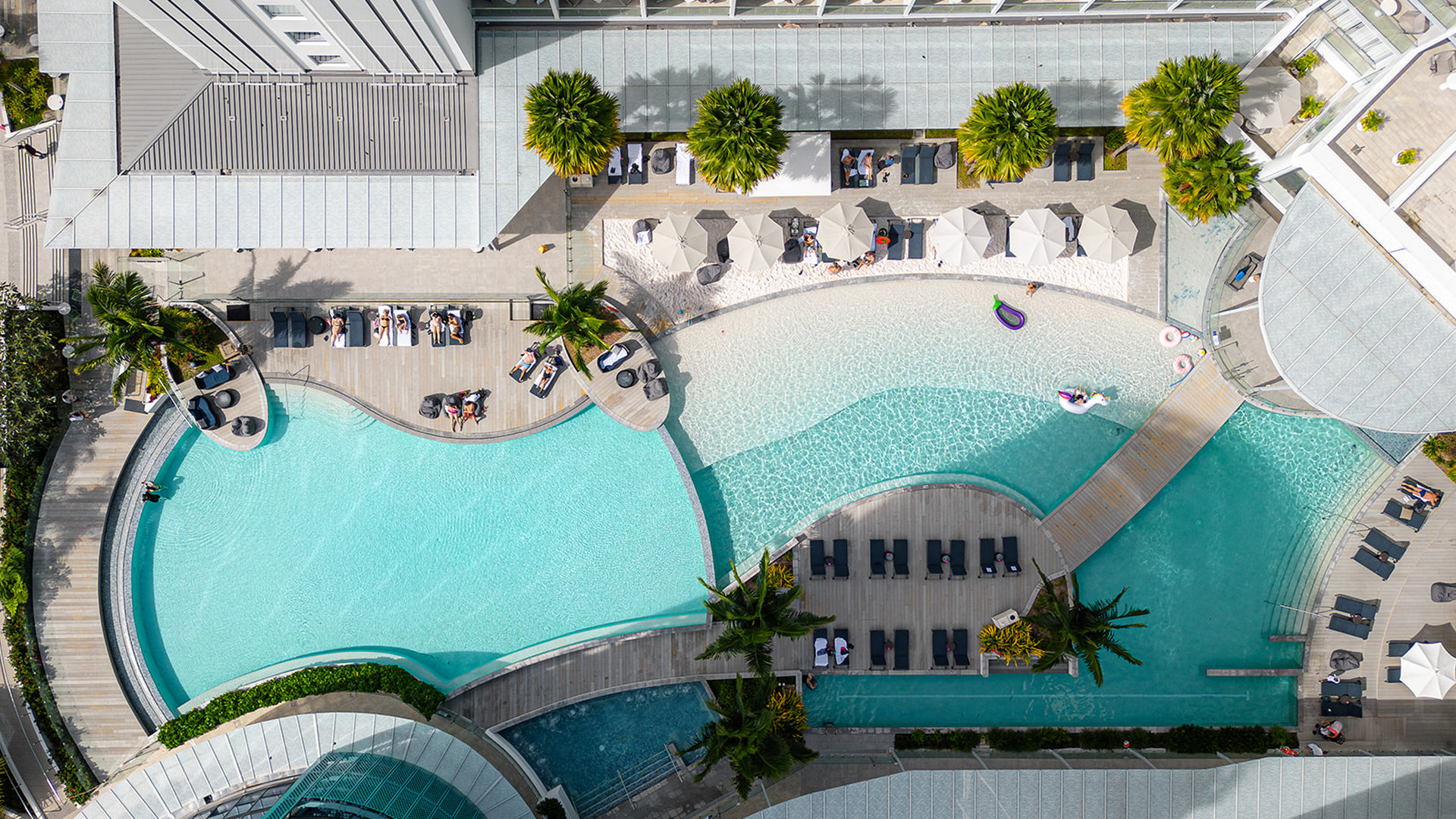 An aerial view of the wrap around swimming pool at Crystalbrook Riley