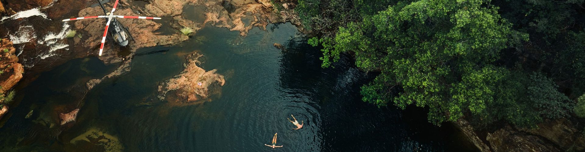 Two Ventur Atlas Broome guests swimming in a secret swimming hole