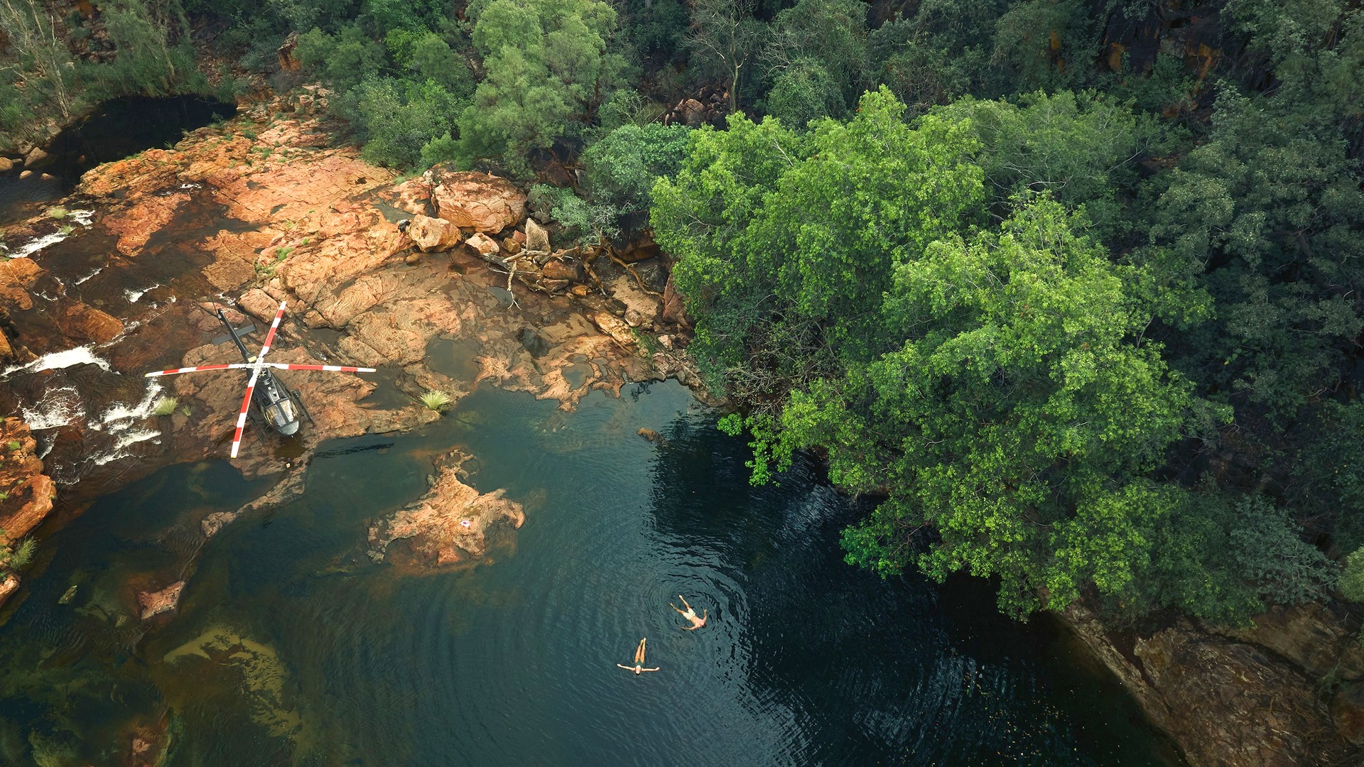 Two Ventur Atlas Broome guests swimming in a secret swimming hole