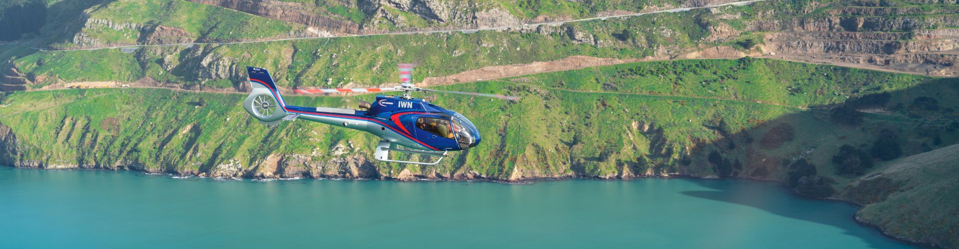 A Garden City Helicopters helicopter exploring the Christchurch coastline