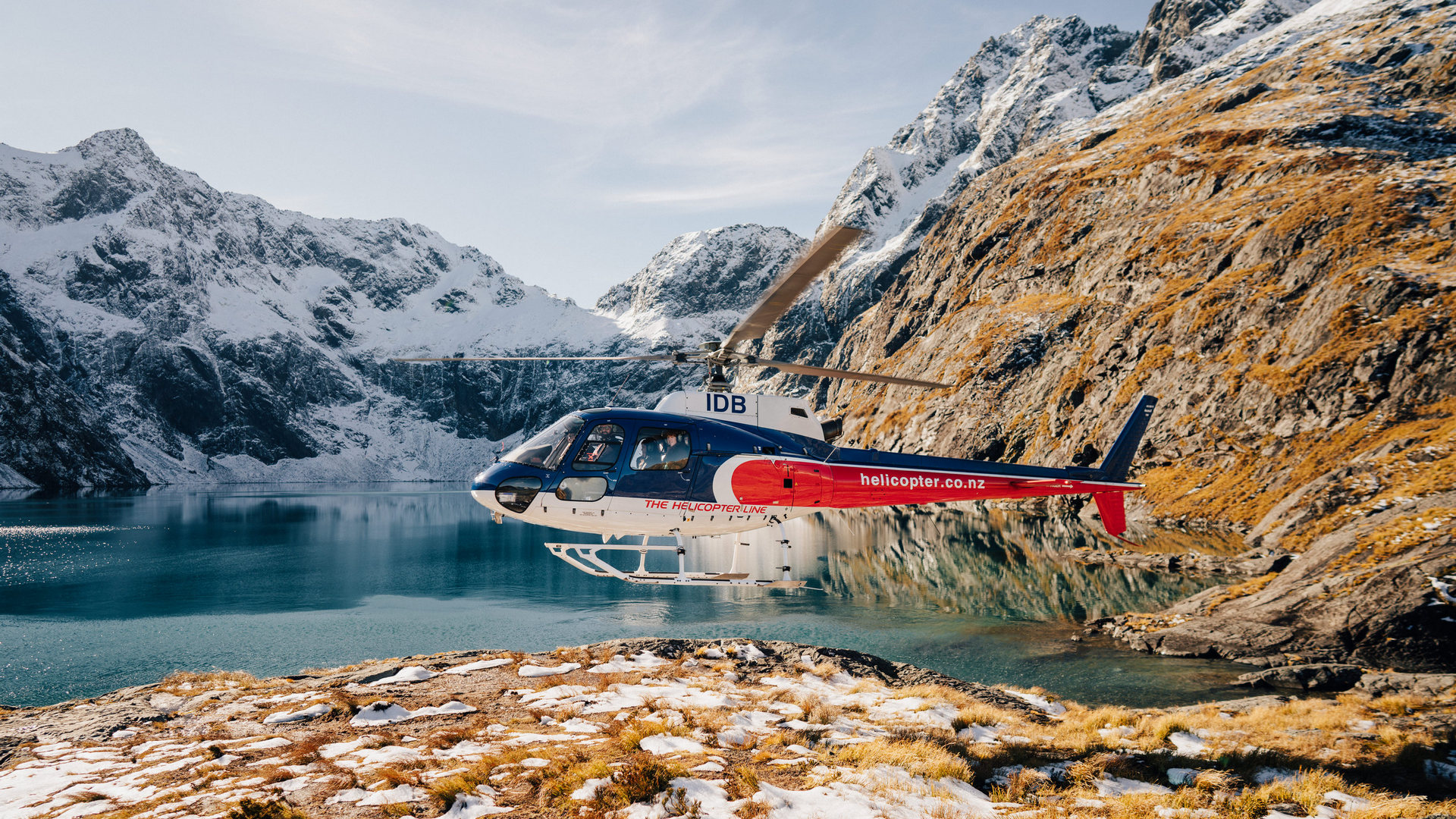 The Helicopter Line Queenstown helicopter taking off from Lake Whakatipu